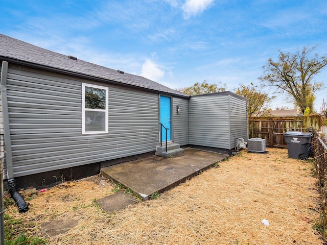 back of property with a patio and central air condition unit