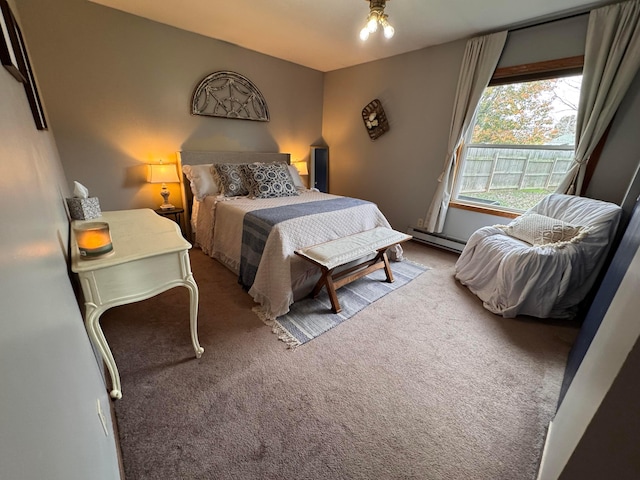 bedroom with light carpet, a chandelier, and a baseboard heating unit