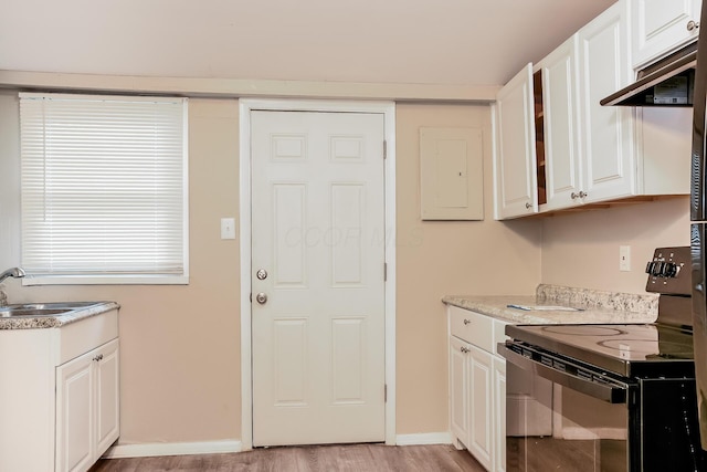 kitchen with electric panel, sink, electric range, white cabinetry, and extractor fan