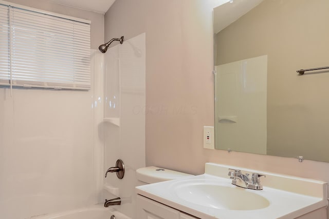 full bathroom featuring vanity,  shower combination, and toilet