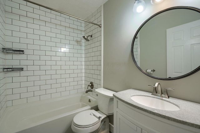 full bathroom featuring vanity, toilet, and tiled shower / bath