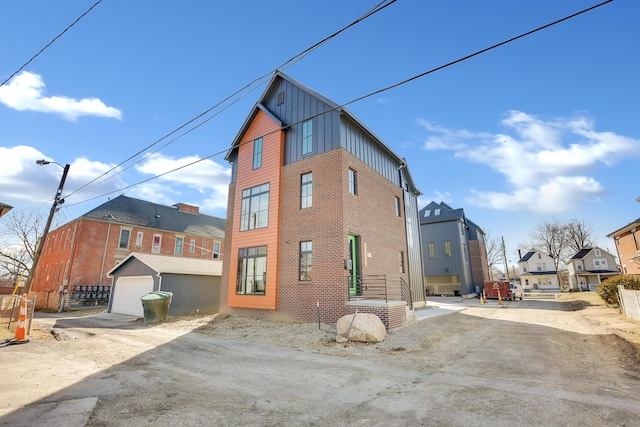 view of home's exterior featuring a garage and an outdoor structure