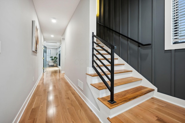 staircase featuring wood-type flooring