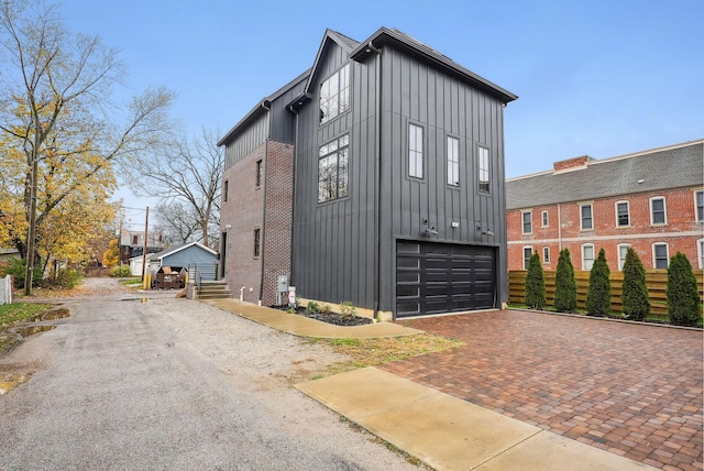 view of side of home featuring a garage