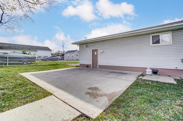 exterior space with a lawn and a patio area