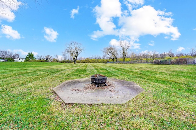 view of yard with a rural view and an outdoor fire pit