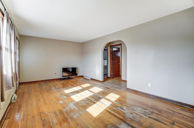 unfurnished living room with light hardwood / wood-style flooring