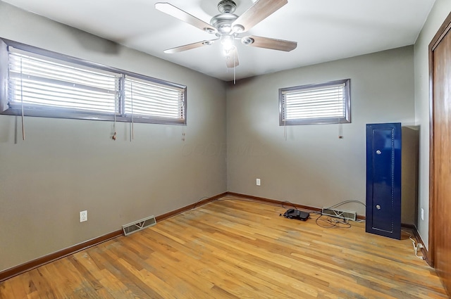 empty room featuring ceiling fan and light hardwood / wood-style floors