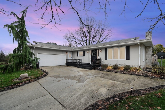 ranch-style home with a garage