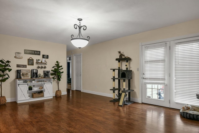 workout room with dark wood-type flooring