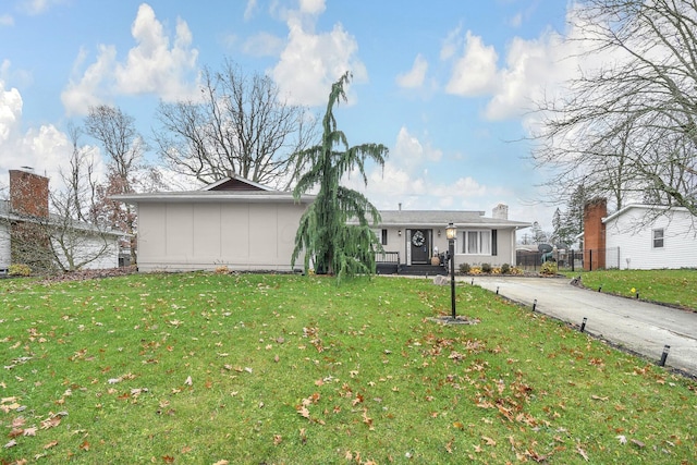 ranch-style house with a front lawn