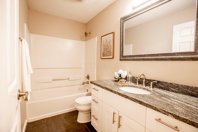 39 Buttles Ave Unit 39, Columbus, OH 43215 - bathroom featuring vanity, shower / washtub combination, a textured ceiling, and tile patterned flooring