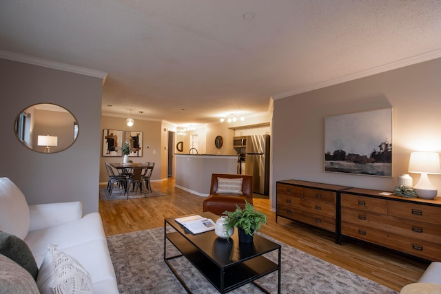 living room with light hardwood / wood-style floors and ornamental molding