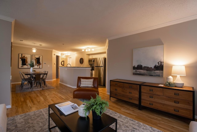 39 Buttles Ave Unit 39, Columbus, OH 43215 - living area featuring light wood finished floors and ornamental molding