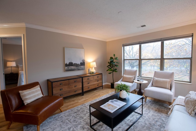 39 Buttles Ave Unit 39, Columbus, OH 43215 - living room featuring wood finished floors, crown molding, and a textured ceiling