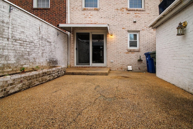 entrance to property featuring a patio