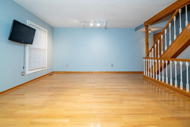 spare room featuring light hardwood / wood-style floors