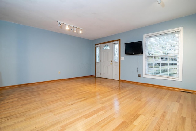 entrance foyer featuring light hardwood / wood-style floors