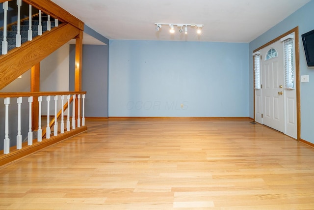 foyer entrance with light hardwood / wood-style floors