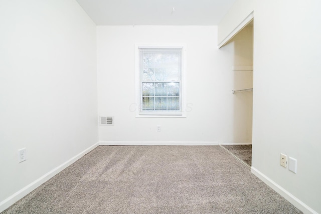 unfurnished room with carpet floors