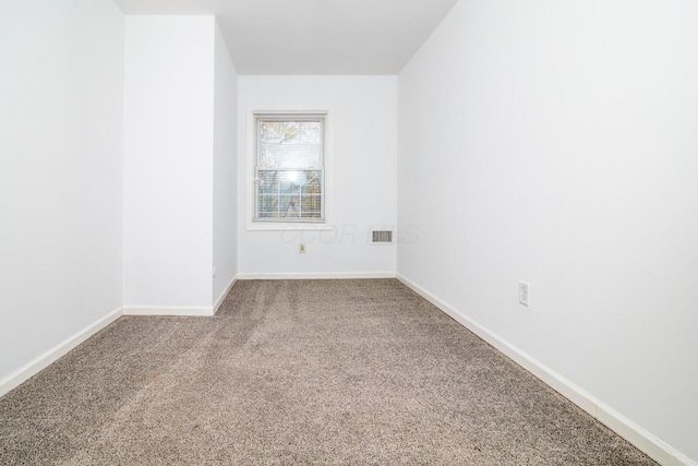 empty room featuring carpet floors