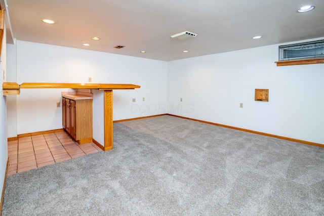 basement with light colored carpet