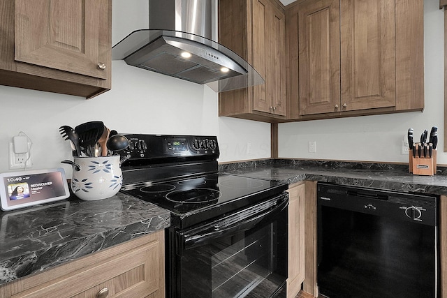 kitchen with black appliances, range hood, and dark stone counters