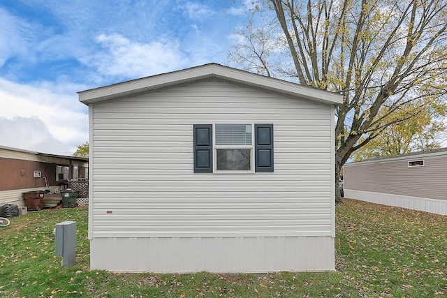 view of home's exterior with a yard