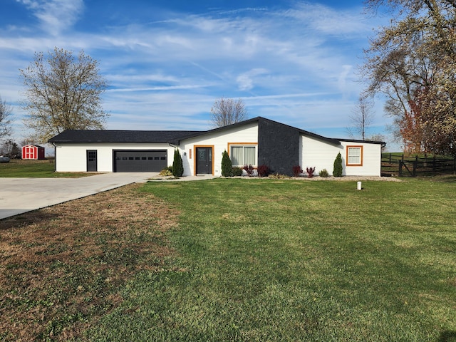 single story home featuring a front yard and a garage