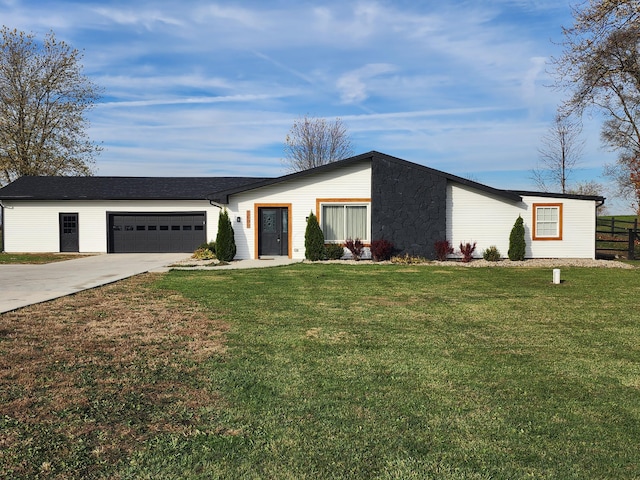 single story home with a garage and a front lawn