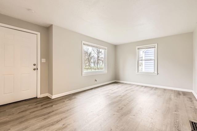 empty room featuring hardwood / wood-style flooring