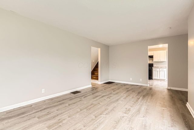 unfurnished living room with light hardwood / wood-style floors