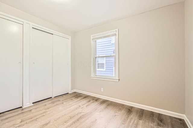 unfurnished bedroom with light hardwood / wood-style floors