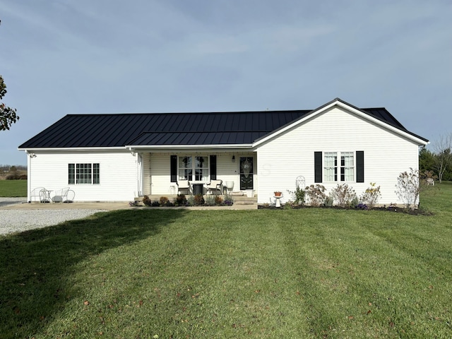 view of front of house with a porch and a front yard