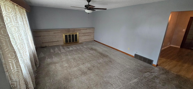 unfurnished living room with carpet, a textured ceiling, and ceiling fan