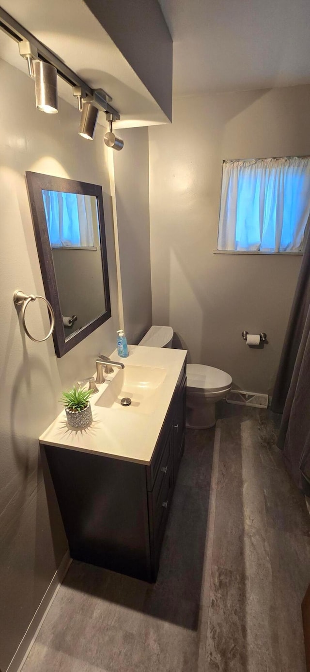 bathroom with vanity and toilet