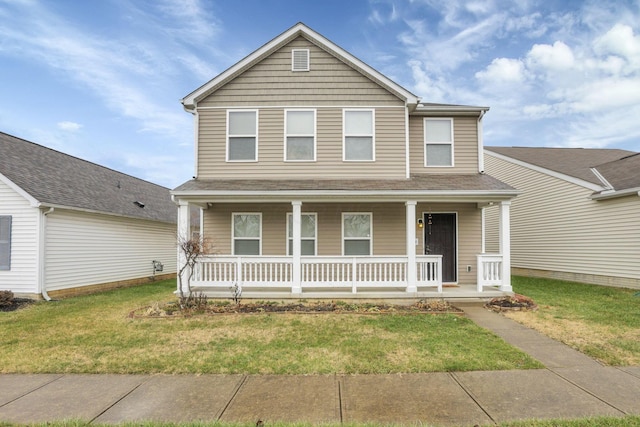 view of front of property featuring a porch and a front lawn