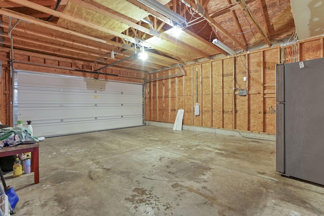 garage featuring stainless steel refrigerator