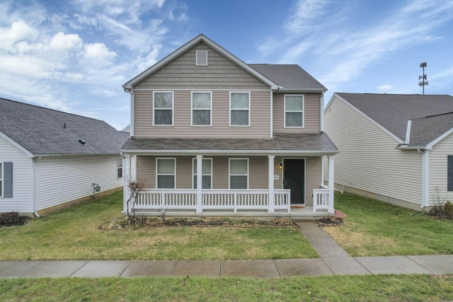 view of front of property with covered porch and a front yard