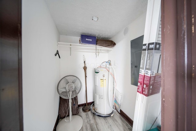 utility room with electric water heater