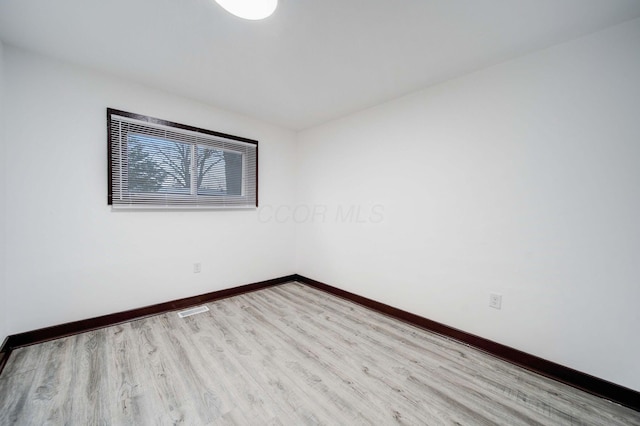 unfurnished room with light hardwood / wood-style floors