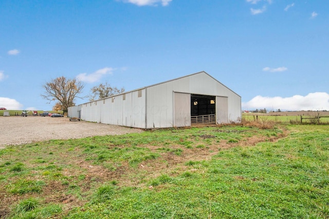 view of outbuilding with a rural view