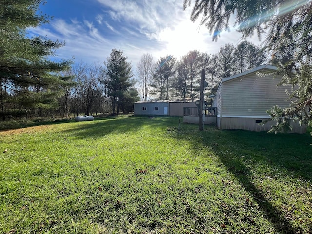 view of yard featuring a deck