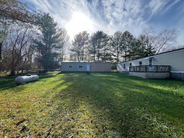 view of yard with a wooden deck