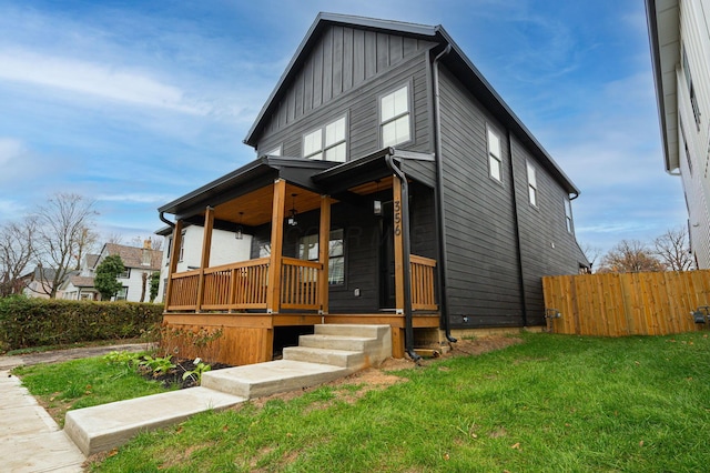 view of front of property with a front lawn and a porch