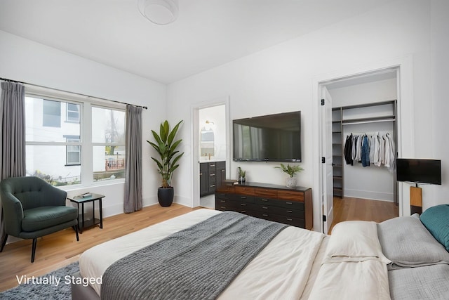 356 Miller Ave, Columbus, OH 43205 - bedroom featuring light wood-type flooring, a spacious closet, and baseboards