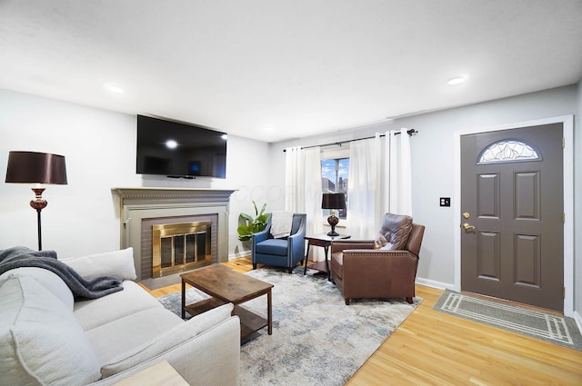 living room featuring a fireplace and hardwood / wood-style flooring