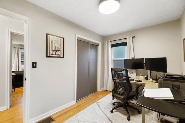 office area with light wood-type flooring