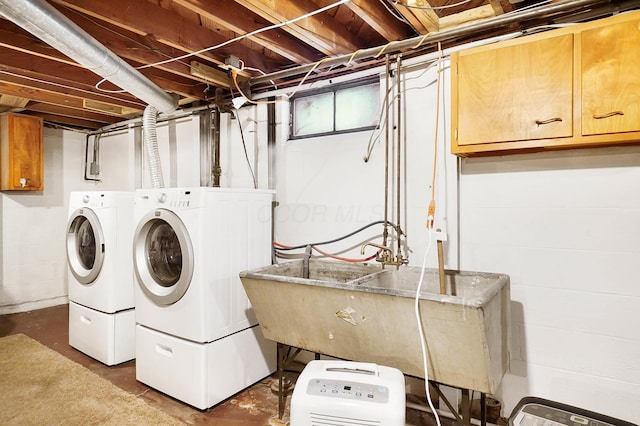 washroom featuring separate washer and dryer and sink