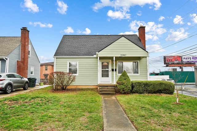 bungalow-style home featuring a front yard